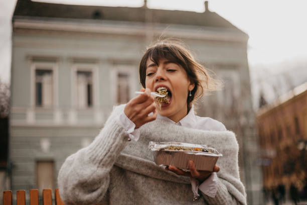 istock Female is about to take a bite of pasta 1301881355