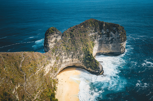Manta Bay also called Kelingking Beach on Nusa Penida Island, Bali, Indonesia, seen from above. Famous for the remote and hidden beach only reachable from a dangerous and steep hike.