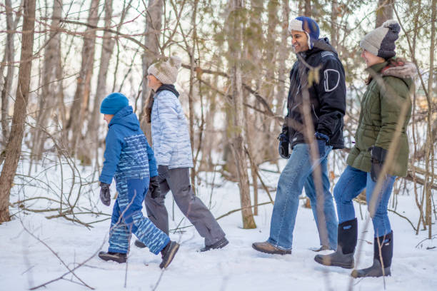 istock Family walking in forest 1301881701