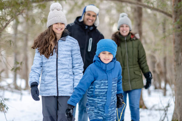 istock Family walking in forest 1301881702