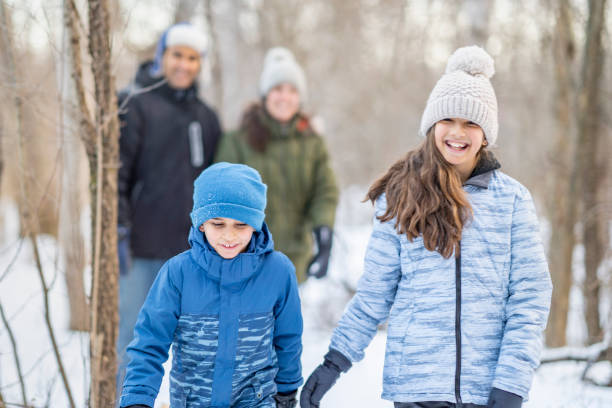 istock Family walking in forest 1301881711
