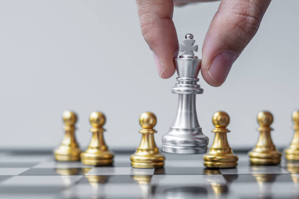 istock silver Chess King figure Stand out from the crowd on Chessboard background. Strategy, leadership, business, teamwork, different, Unique and Human resource management concept 1301882581