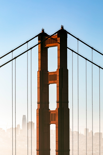 The iconic north tower of the Golden Gate Bridge is backed by a the city of San Francisco as the morning hazes clears.