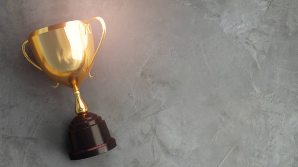 istock Golden trophy on concrete background. 3d rendering. 1301885680
