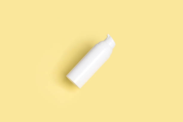 istock Creative layout with levitating beauty product on yellow background 1301886559