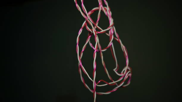 istock Realistic white red electrical wires with black background., Connection home cables set. Wire connection, cable power energy. 1301888298