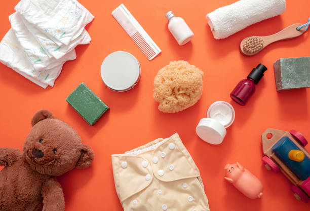 istock Baby bathing and diaper changing products background, top view 1301895578