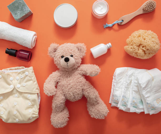 istock Baby bathing and diaper changing products background, top view 1301895582