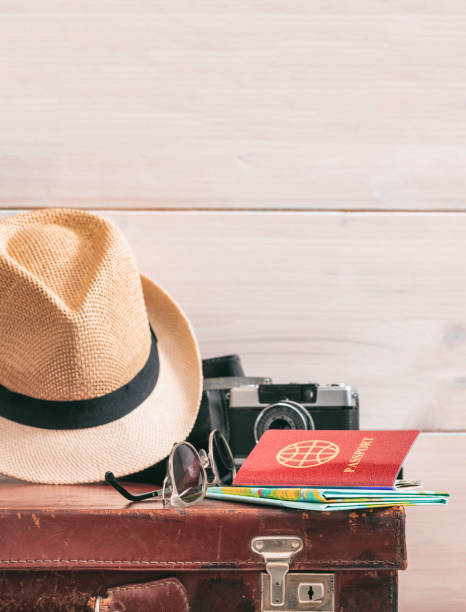 istock Travel packing concept, vintage suitcase and passport on white background - copy space 1301895608