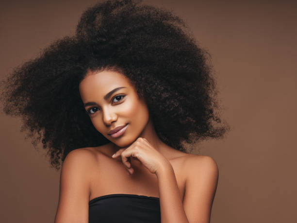 istock Beautiful smiling girl with curly hairstyle 1301904965