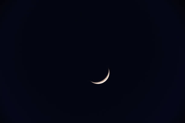 istock Young crescent Moon photographed with telescope. 1301907716