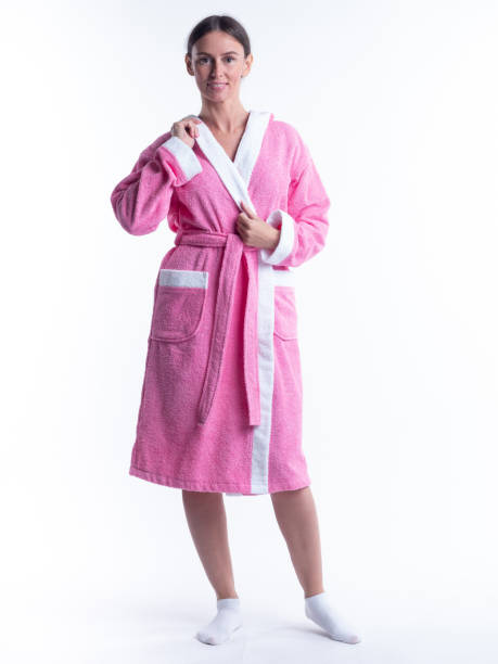 istock woman in a Bathrobe on an isolated white background with a smile on her face. 1301908701