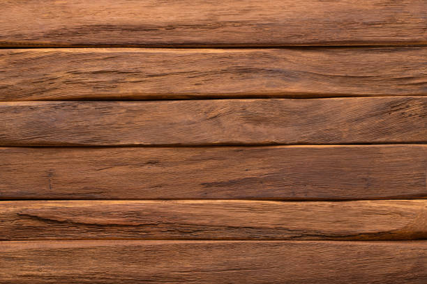 istock dark plank wall, wood texture background. brown board with natural pattern 1301909359