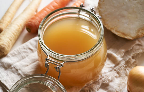 istock A glass jar full of beef bone broth, with vegetables 1301914801