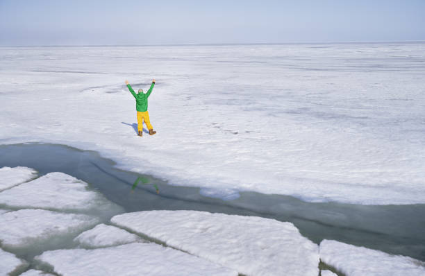 istock Snowboarding man outdoors in icy and snowy landscape 1301914837