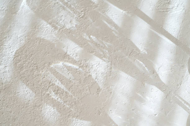 istock White concrete like background texture with shadows from blinds and glasses 1301914944