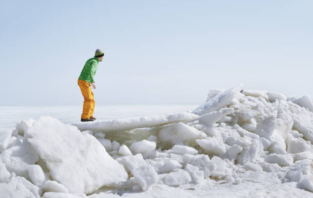 istock Young adult man outdoors exploring icy landscape 1301914964