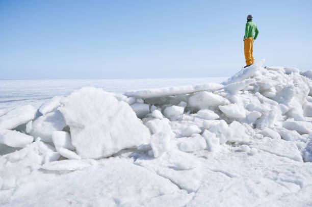 istock Young adult man outdoors exploring icy landscape 1301915024
