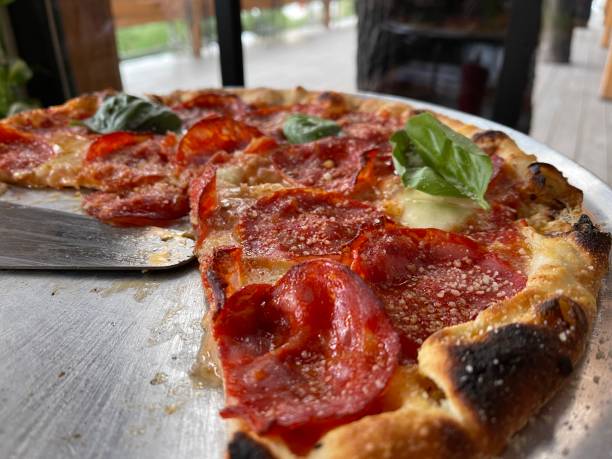 istock pizza with cheese and salami close-up 1301916127