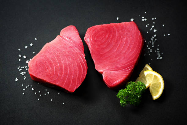 fresh tuna fish fillet steaks isolated on white background - tuna tuna steak raw freshness imagens e fotografias de stock