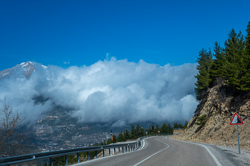 A road high in the middle taurus. Snowy mountain, sunken clouds