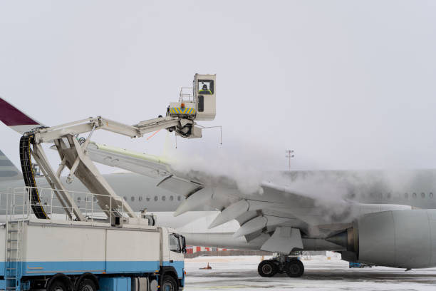 istock De-icing the aircraft before the flight. The deicing machine sprinkles the wing of a passenger plane with antifreeze. Winter at the airport. Snow. Aviation handling. Steam. Airport service 1301918593
