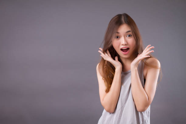 istock excited woman studio isolated portrait 1301919847