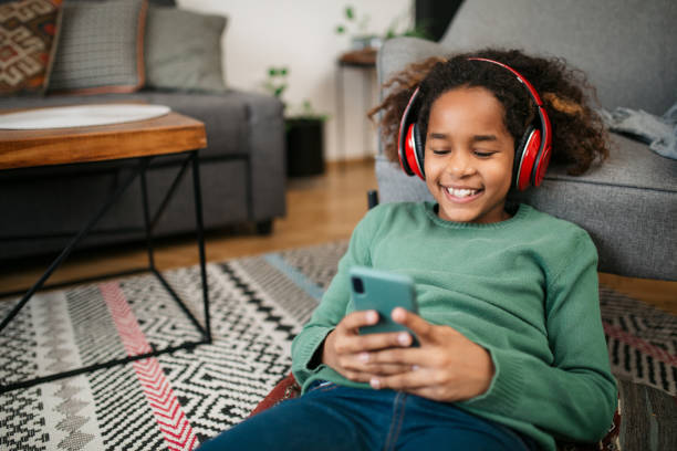 istock Young African American girl using a smart phone 1301921223