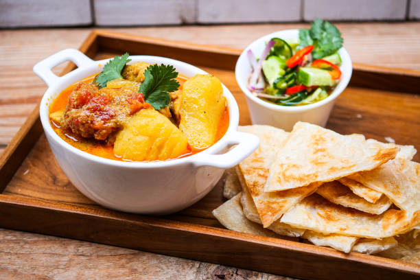 chicken curry bowl serves with  roti, stock photo