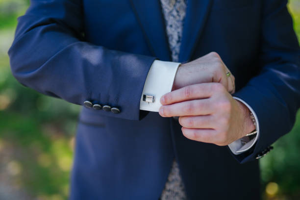 istock Groom showing his cufflinks 1301922108