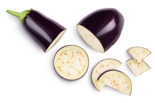 Eggplant or aubergine with slices isolated on white background. Clipping path and full depth of field. top, view, flat lay.