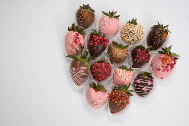 istock Assorted strawberries in chocolate, sweet dessert, free space for your text, sprinkled with nuts, top view, isolated background. 1301926951