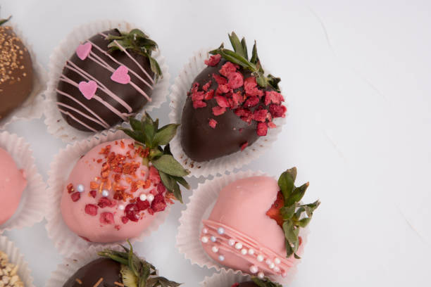 istock Assorted strawberries in chocolate, sweet dessert, free space for your text, sprinkled with nuts, top view, isolated background. 1301926960