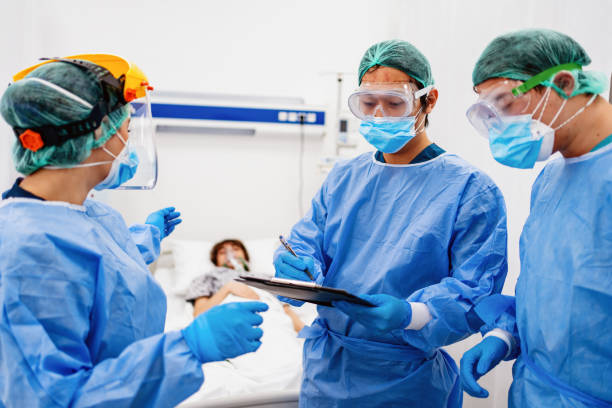 istock healthcare workers talking at the UCI 1301927675