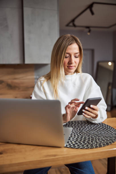 istock Focused lady clicking on her mobile phone 1301928752