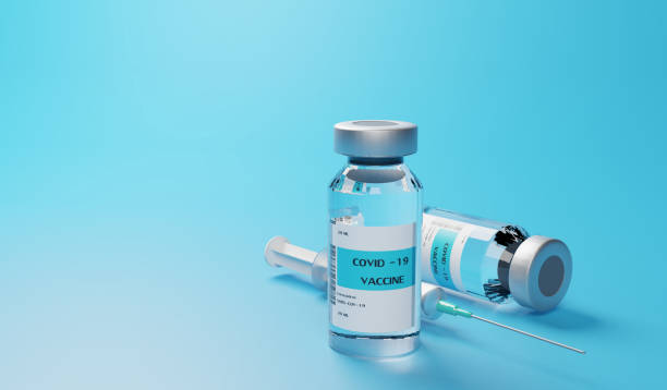 istock COVID 19 vaccine on blue background 1301933353