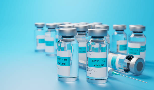 istock COVID 19 vaccine on blue background 1301933360