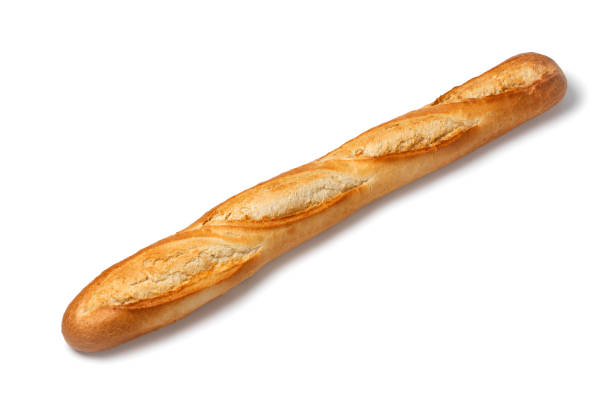 Single fresh baked traditional French baguette Single fresh baked traditional French baguette isolated on white background baguette photos stock pictures, royalty-free photos & images