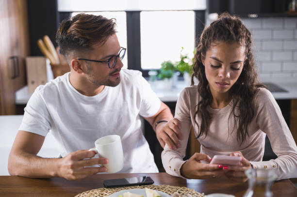 istock Young couple at home kitchen in the morning having relationship problems. Arguing. 1301936184
