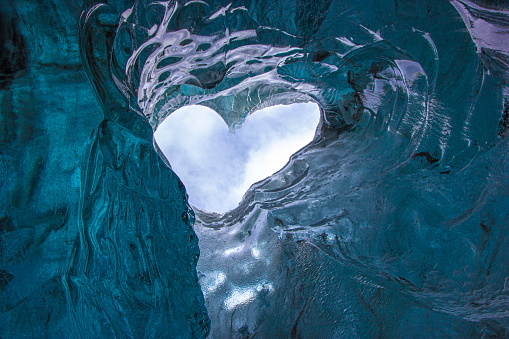 Perfect heart formation inside an ice cave in Vatnajokull glacier, Iceland.