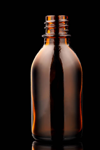 istock Glass jar for medicines on a black background 1301937165
