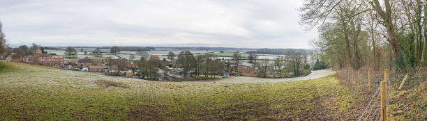 istock Panoramic view over English rural countryside landscape 1301938325