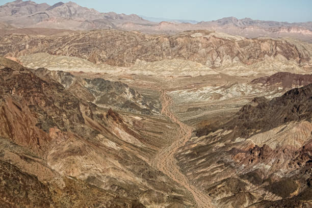 istock Ariel view of desert road in valleys. 1301938547