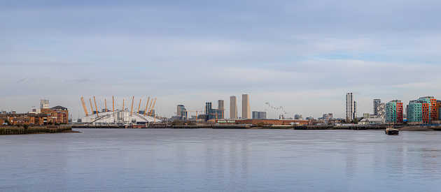 London, United Kingdom - November 24 2021: Panorama of Greenwich Peninsula and surrounding area looking across the Thames river.