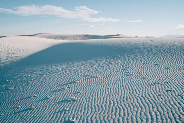 From above of picturesque sandy coast of dunes in White Sands National Park in sunny day in summer in America