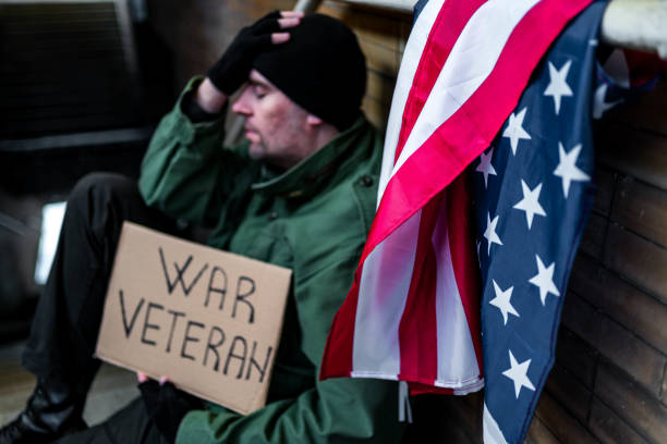istock Homeless holding cardboard sign with text 