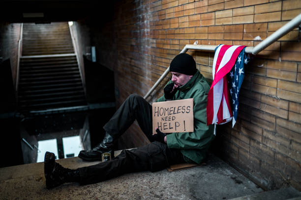 istock Homeless veteran holding cardboard sign with text 