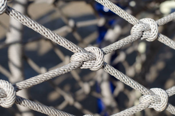 istock Rope. Mountaineering equipment. A knot on a rope. Grid. Braided rope. 1301941266