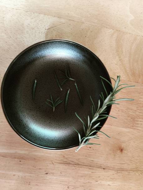 istock A rosemary in a black saucer 1301942233