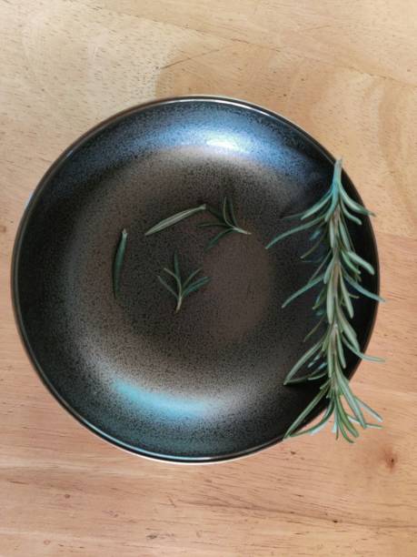 istock A rosemary in a black saucer 1301942237